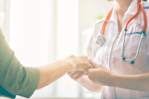 Female patient listening to doctor